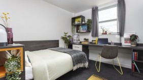 Mill Point classic ensuite bedroom with large comfy bed, desk and storage space
